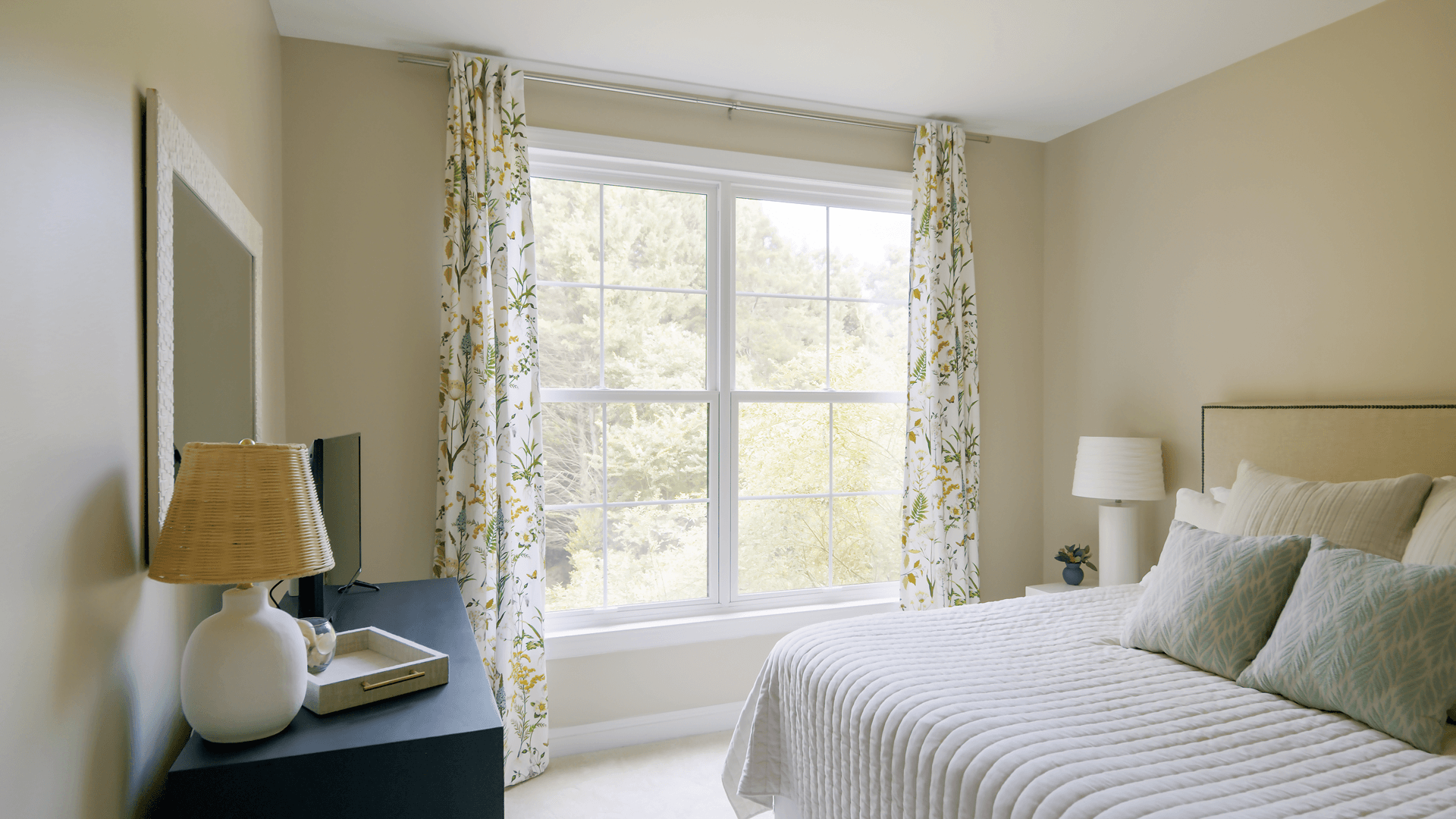 Infinity from Marvin double hung windows in a bedroom.