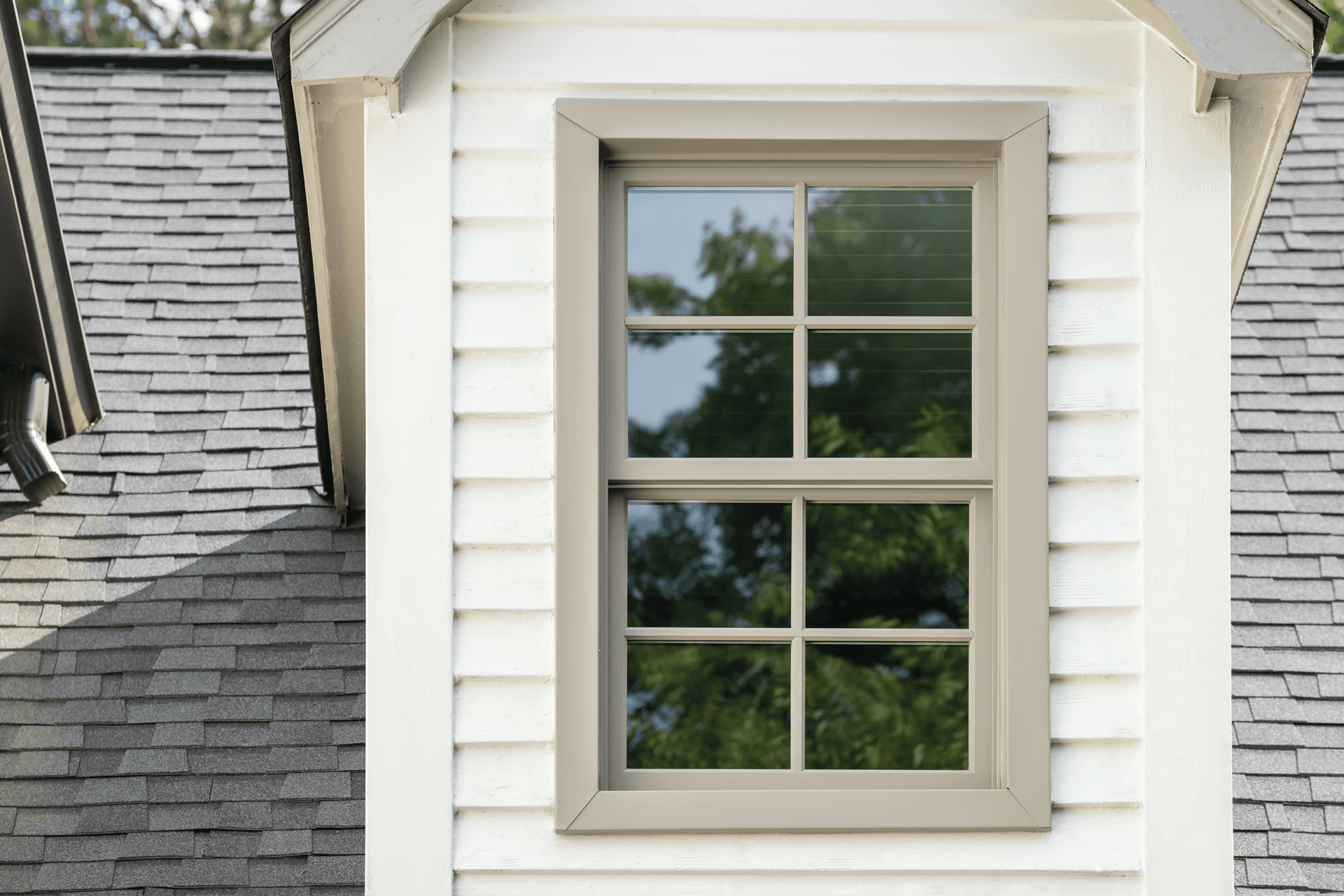 The exterior of a colonial home with Infinity from Marvin double hung windows.