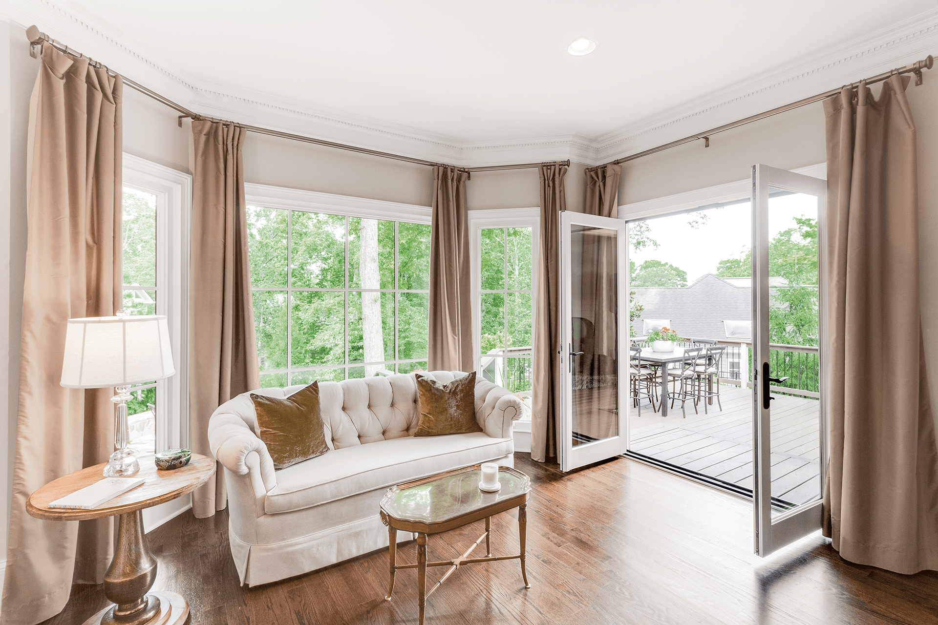 Bedroom interior with an opened two-panel Inswing French door.